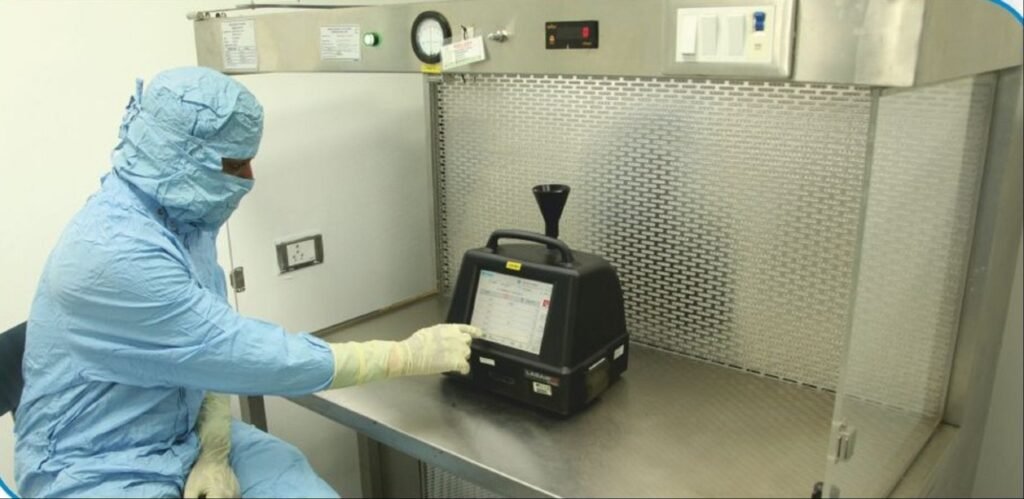 A-cleanroom-operator-performing-non-viable-particle-monitoring